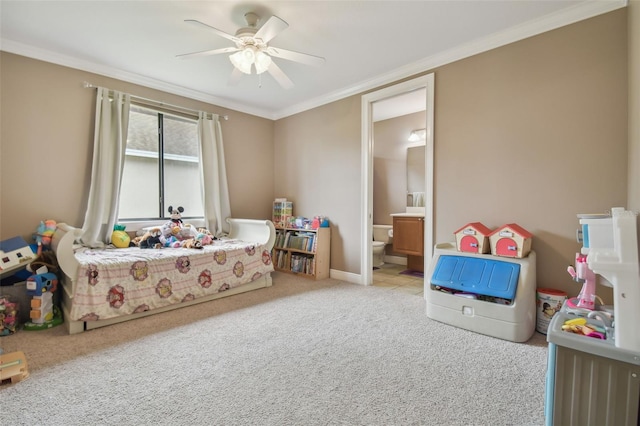 carpeted bedroom with crown molding, ceiling fan, and connected bathroom