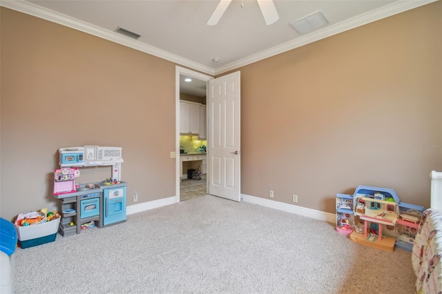 playroom with light carpet, crown molding, and ceiling fan