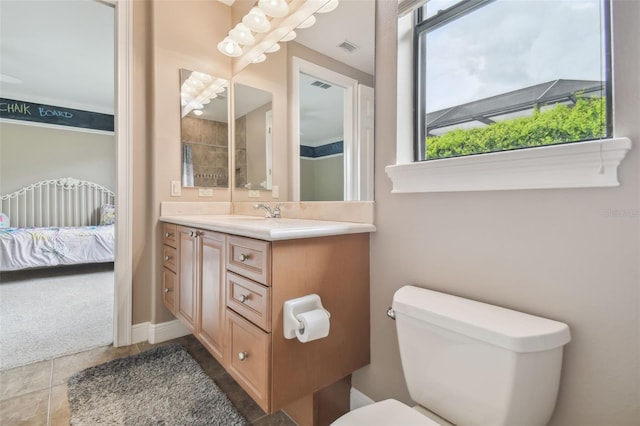 bathroom with tile patterned floors, vanity, and toilet