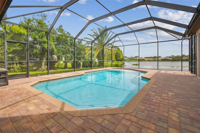 view of swimming pool with a lanai, a patio, and a water view