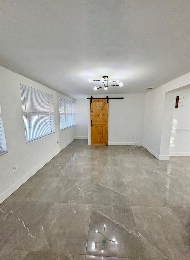 spare room with a barn door