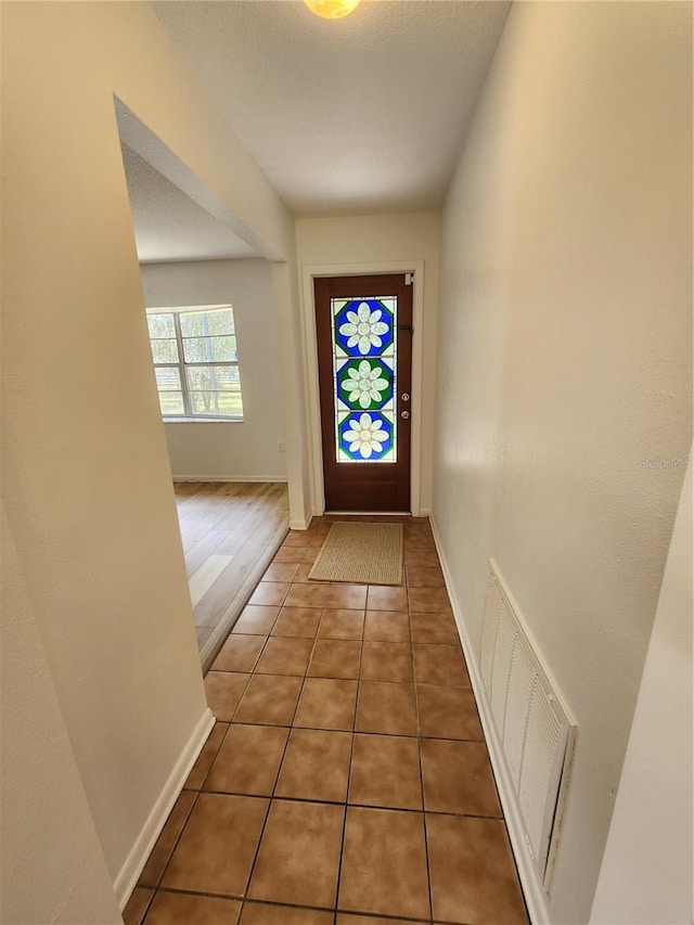 entryway with dark hardwood / wood-style floors