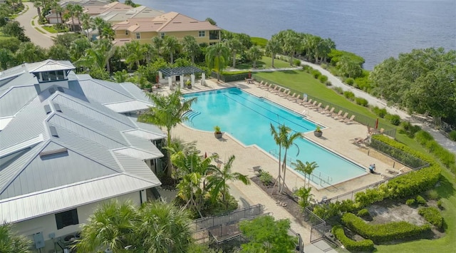 view of swimming pool with a water view