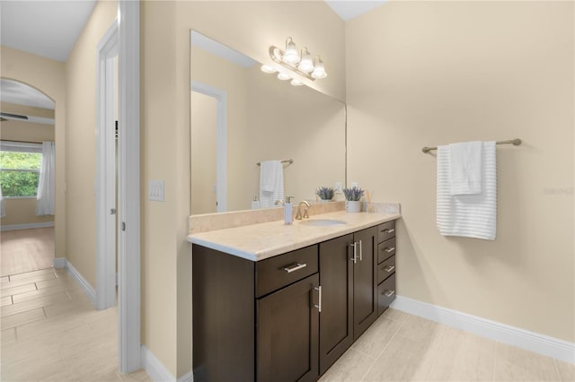 bathroom with tile patterned flooring and vanity