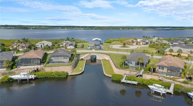 birds eye view of property featuring a water view