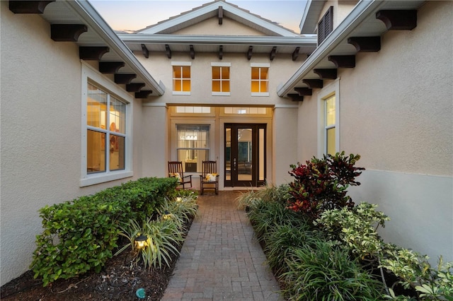 exterior entry at dusk with french doors