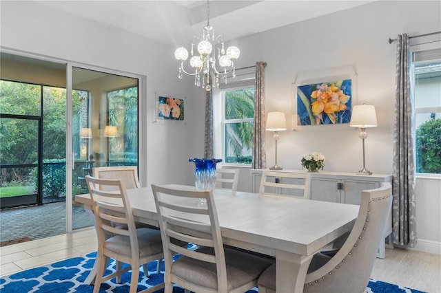 dining space featuring a notable chandelier