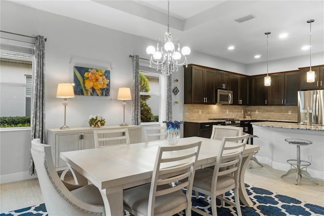 dining space featuring a chandelier and a wealth of natural light