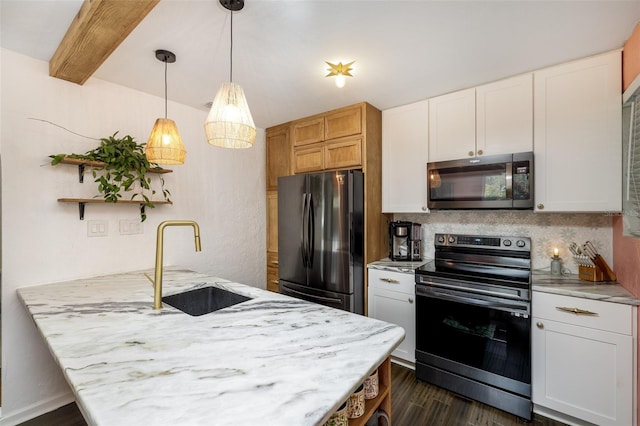 kitchen featuring white cabinetry, appliances with stainless steel finishes, tasteful backsplash, and sink