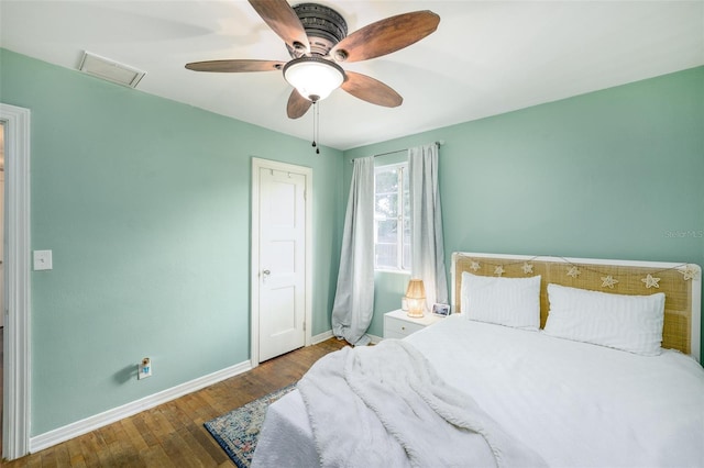 bedroom with wood-type flooring and ceiling fan