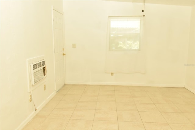 clothes washing area with light tile patterned floors