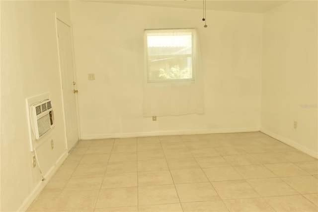 laundry area with heating unit and light tile patterned floors