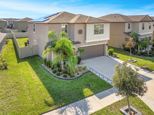 view of front of property with a front lawn and a garage