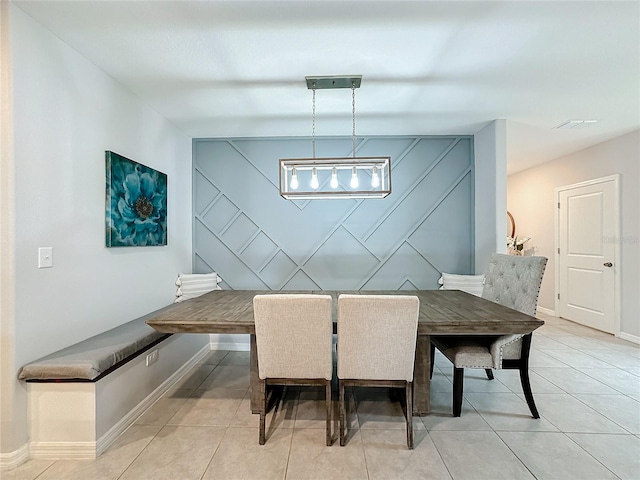 dining area featuring light tile patterned floors