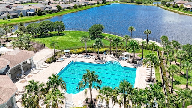 view of pool featuring a water view and a patio area