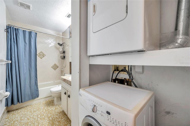 full bathroom with a textured ceiling, stacked washer / dryer, shower / tub combo, vanity, and toilet