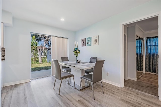 dining space featuring light wood-type flooring