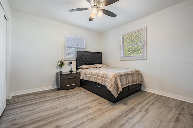 bedroom with ceiling fan and light hardwood / wood-style flooring