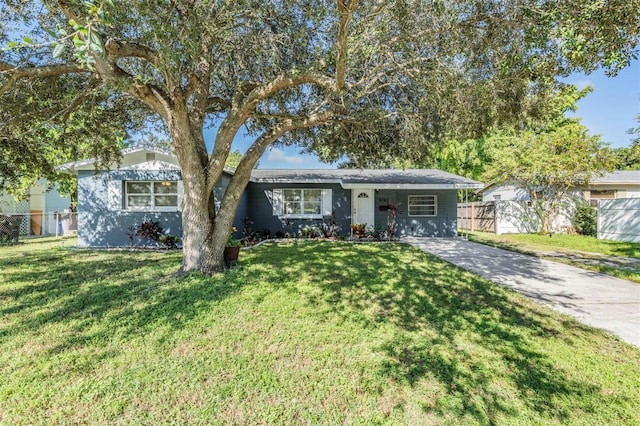 single story home with a front yard