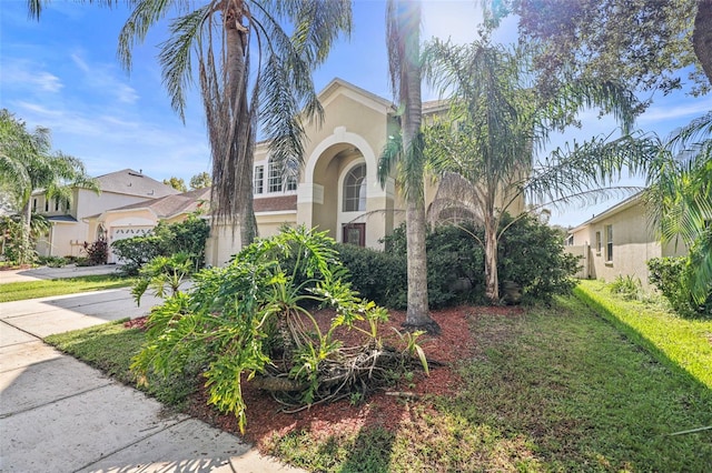 mediterranean / spanish-style home featuring a garage