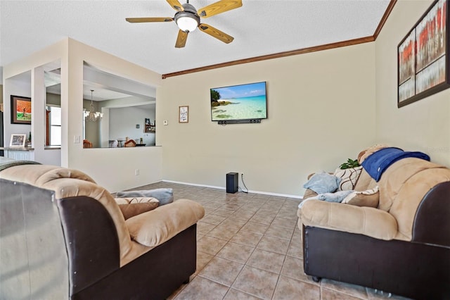 tiled living room featuring a textured ceiling, ceiling fan with notable chandelier, and crown molding