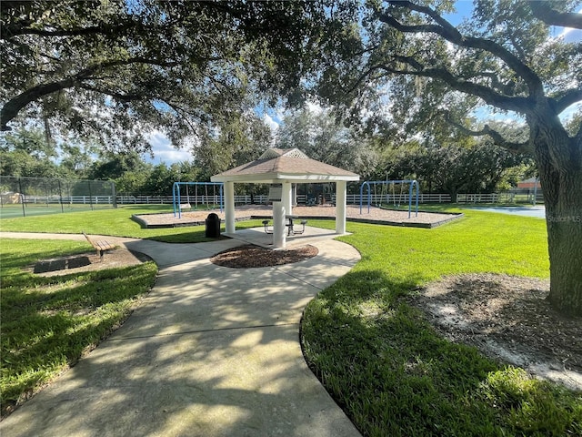 view of home's community featuring a playground, a gazebo, and a yard