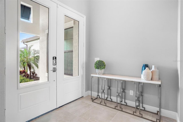 entrance foyer featuring light tile patterned floors