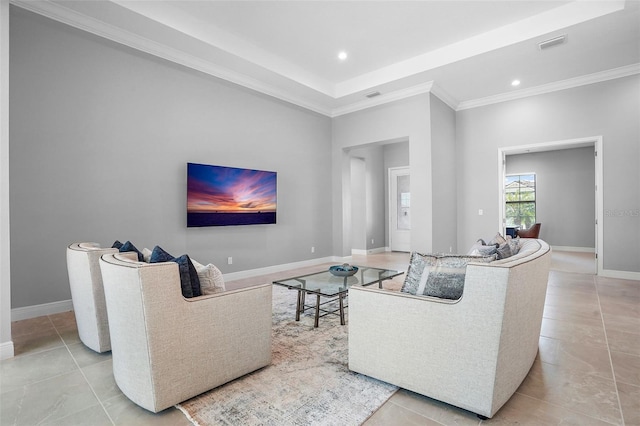 tiled living room featuring a tray ceiling and crown molding