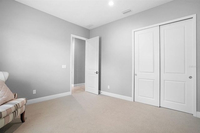 unfurnished room with light colored carpet