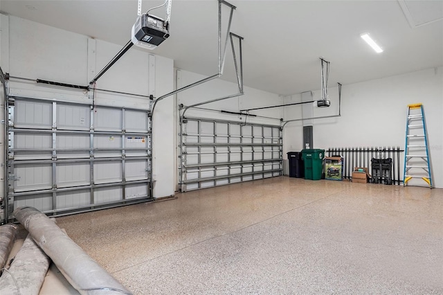 garage with electric panel and a garage door opener