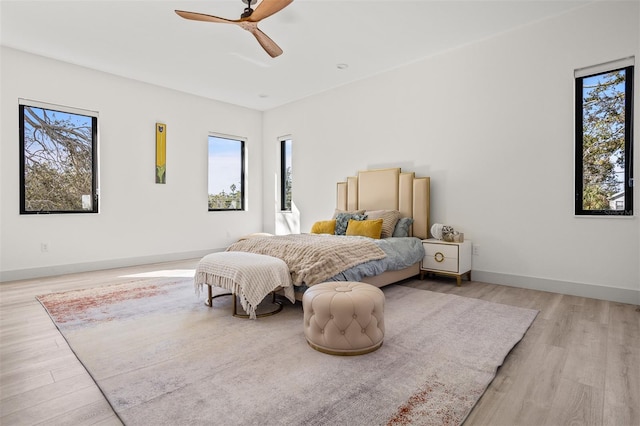 bedroom featuring ceiling fan and light hardwood / wood-style floors