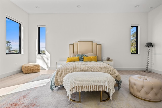 bedroom with hardwood / wood-style flooring