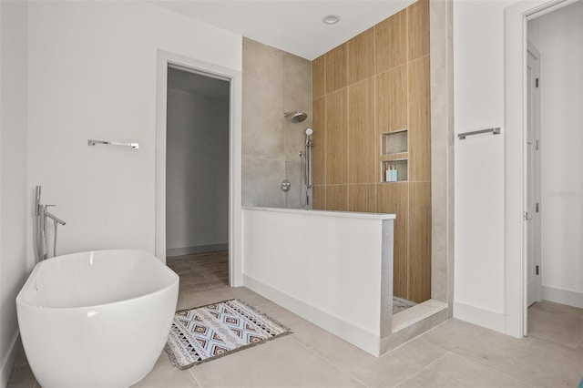 bathroom featuring shower with separate bathtub and tile patterned flooring