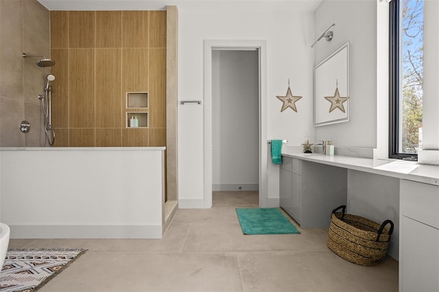 bathroom with vanity, concrete floors, and walk in shower