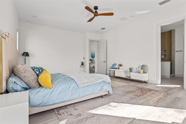 bedroom with ceiling fan and hardwood / wood-style flooring