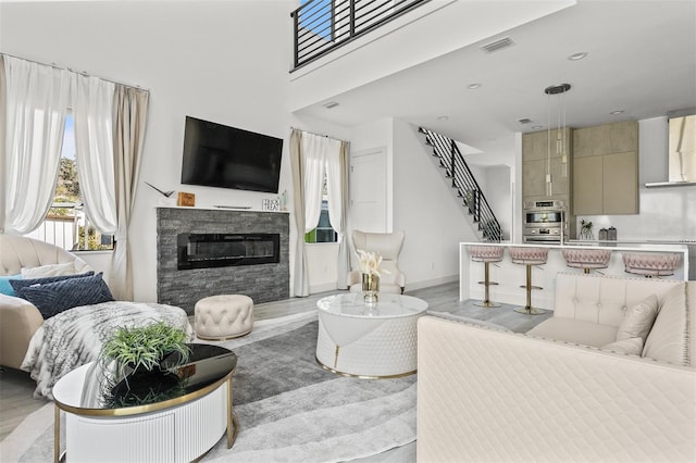 living room featuring light hardwood / wood-style flooring and a fireplace