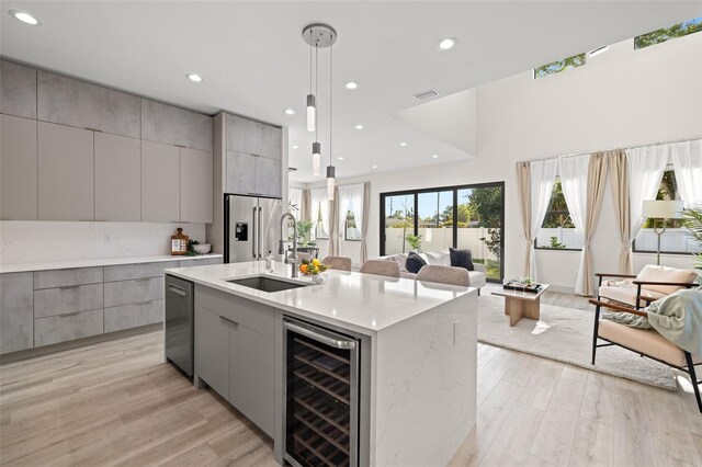 kitchen with modern cabinets, gray cabinets, and wine cooler