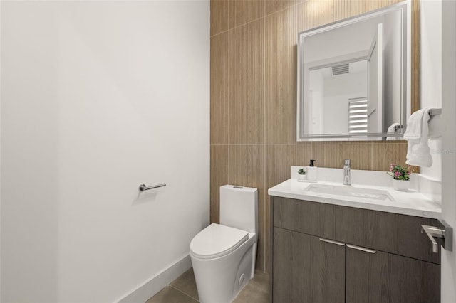 bathroom featuring tile patterned floors, visible vents, vanity, and toilet