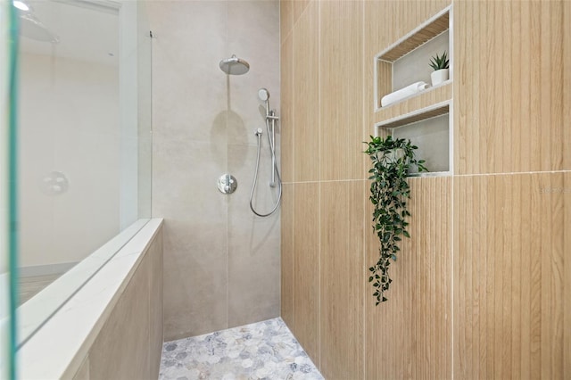 full bath featuring tiled shower