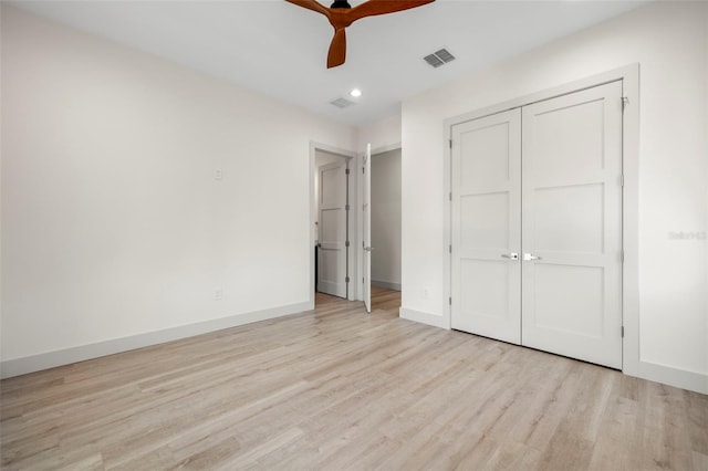 unfurnished bedroom featuring recessed lighting, visible vents, light wood-type flooring, a closet, and baseboards