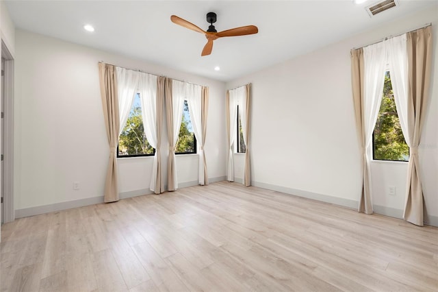 unfurnished room featuring recessed lighting, light wood-style floors, visible vents, and ceiling fan
