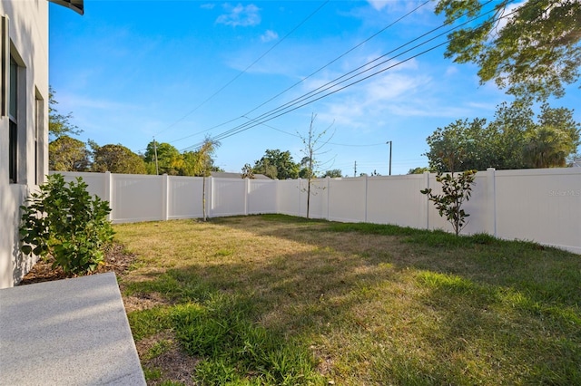 view of yard with a fenced backyard