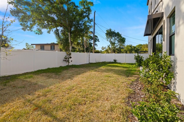 view of yard featuring a fenced backyard