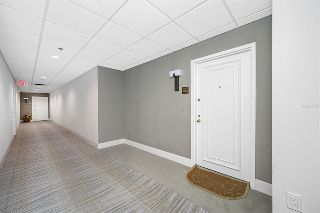 hallway featuring a paneled ceiling