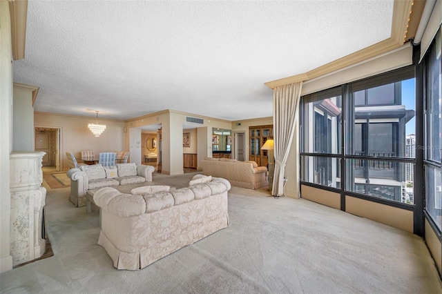 living room with light colored carpet, a textured ceiling, crown molding, and a chandelier