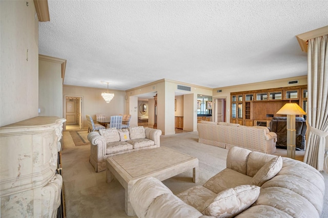 living room with light carpet, a textured ceiling, and ornamental molding