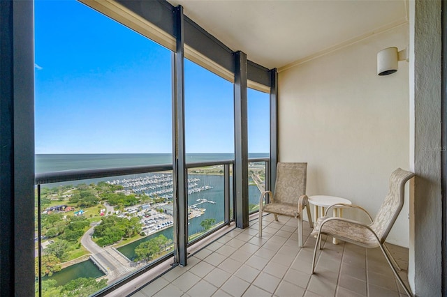 balcony featuring a water view