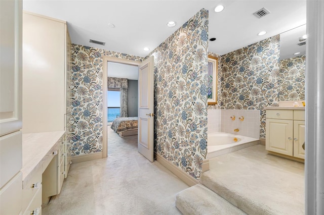 bathroom with a bath and vanity