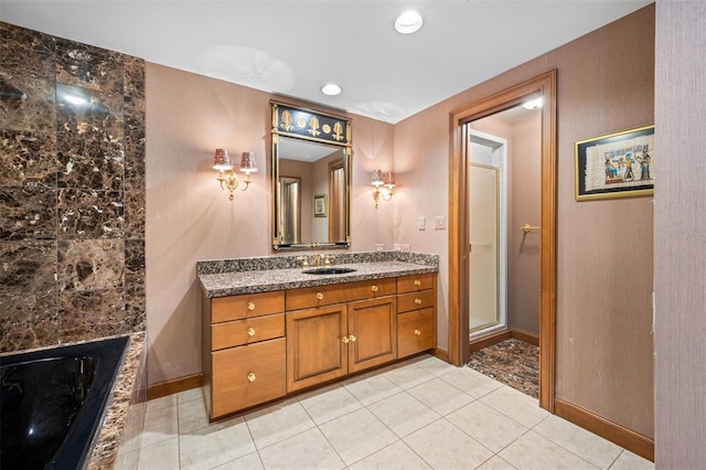 bathroom featuring tile patterned floors, vanity, and separate shower and tub