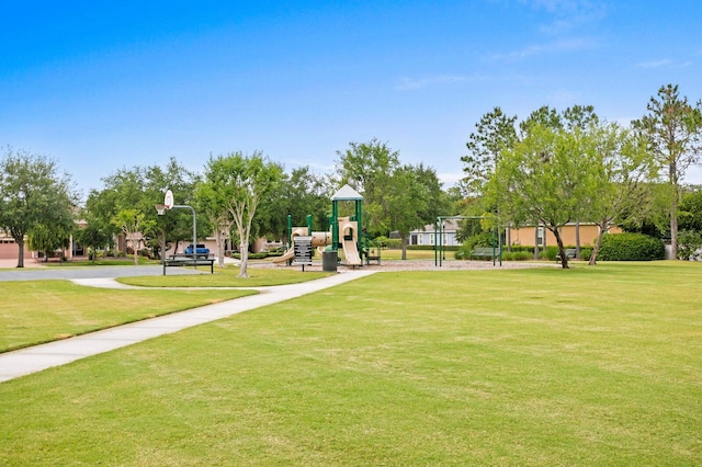 surrounding community with a playground and a yard